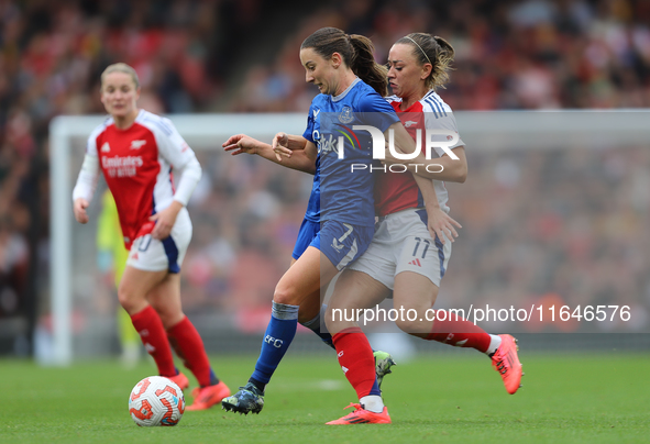 Arsenal's Katie McCabe holds back Everton's Clare Wheeler during the Barclays FA Women's Super League match between Arsenal and Everton at t...