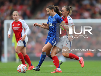 Arsenal's Katie McCabe holds back Everton's Clare Wheeler during the Barclays FA Women's Super League match between Arsenal and Everton at t...