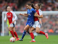 Arsenal's Katie McCabe holds back Everton's Clare Wheeler during the Barclays FA Women's Super League match between Arsenal and Everton at t...