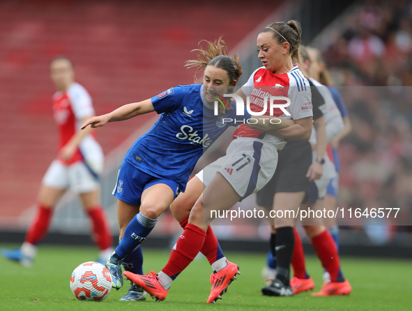 Arsenal's Katie McCabe holds back Everton's Clare Wheeler during the Barclays FA Women's Super League match between Arsenal and Everton at t...