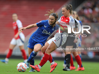 Arsenal's Katie McCabe holds back Everton's Clare Wheeler during the Barclays FA Women's Super League match between Arsenal and Everton at t...