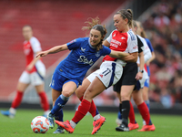 Arsenal's Katie McCabe holds back Everton's Clare Wheeler during the Barclays FA Women's Super League match between Arsenal and Everton at t...