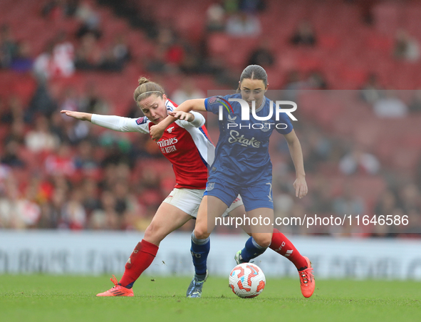 Kim Little of Arsenal and Everton's Clare Wheeler participate in the Barclays FA Women's Super League match between Arsenal and Everton at t...