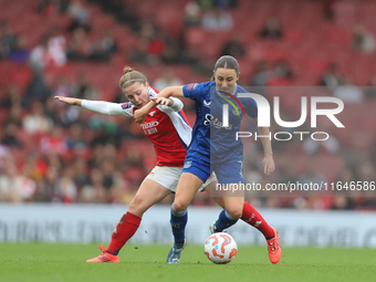 Kim Little of Arsenal and Everton's Clare Wheeler participate in the Barclays FA Women's Super League match between Arsenal and Everton at t...