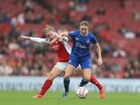 Kim Little of Arsenal and Everton's Clare Wheeler participate in the Barclays FA Women's Super League match between Arsenal and Everton at t...