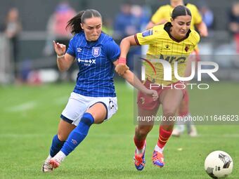 Andria Georgiou, 15, from Watford, is challenged by Sophie Peskett, 17, from Ipswich, during the FA Women's Premier League Premier Division...