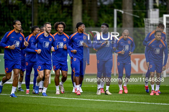 Netherlands players Stefan de Vrij, Virgil van Dijk, Joshua Zirkzee, Denzel Dumfries, Donyell Malen, and Justin Kluivert participate in the...