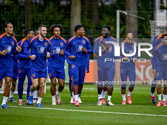 Netherlands players Stefan de Vrij, Virgil van Dijk, Joshua Zirkzee, Denzel Dumfries, Donyell Malen, and Justin Kluivert participate in the...