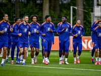 Netherlands players Stefan de Vrij, Virgil van Dijk, Joshua Zirkzee, Denzel Dumfries, Donyell Malen, and Justin Kluivert participate in the...