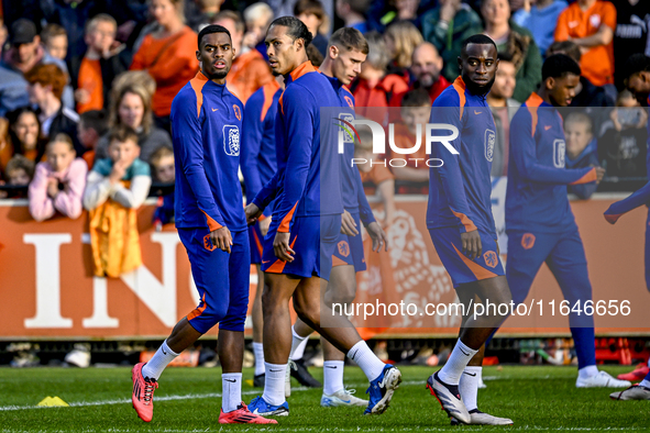 Netherlands players Ryan Gravenberch, Virgil van Dijk, and Lutsharel Geertruida participate in the training and press conference for the Net...