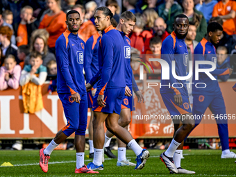 Netherlands players Ryan Gravenberch, Virgil van Dijk, and Lutsharel Geertruida participate in the training and press conference for the Net...