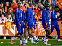 Netherlands players Ryan Gravenberch, Virgil van Dijk, and Lutsharel Geertruida participate in the training and press conference for the Net...