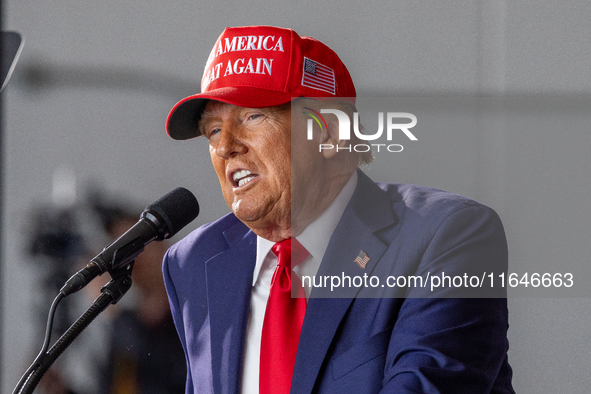 Former President Donald Trump, the Republican presidential nominee, holds a campaign rally at Dodge County Airport in Juneau, Wisconsin, on...