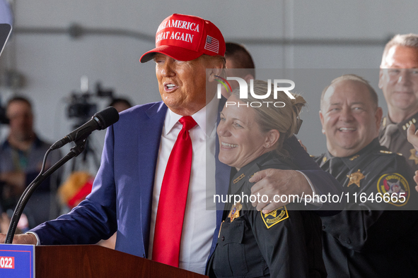 Former President Donald Trump, the Republican presidential nominee, holds a campaign rally at Dodge County Airport in Juneau, Wisconsin, on...