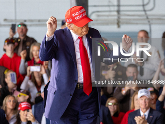 Former President Donald Trump, the Republican presidential nominee, holds a campaign rally at Dodge County Airport in Juneau, Wisconsin, on...