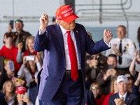 Former President Donald Trump, the Republican presidential nominee, holds a campaign rally at Dodge County Airport in Juneau, Wisconsin, on...