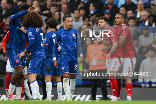 Neco Williams of Nottingham Forest is furious with Marc Cucurella of Chelsea during the Premier League match between Chelsea and Nottingham...