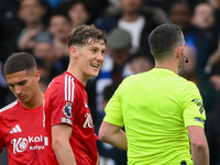 Ryan Yates of Nottingham Forest talks with referee Chris Kavanagh during the Premier League match between Chelsea and Nottingham Forest at S...