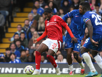 Anthony Elanga of Nottingham Forest is under pressure from Wesley Fofana and Moises Caicedo of Chelsea during the Premier League match betwe...