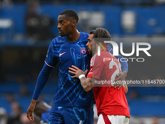 Tosin Adarabioyo of Chelsea and Jota Silva of Nottingham Forest follow during the Premier League match between Chelsea and Nottingham Forest...