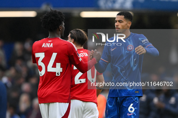 Ola Aina of Nottingham Forest shakes hands with Levi Colwill of Chelsea after the final whistle during the Premier League match between Chel...