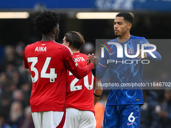 Ola Aina of Nottingham Forest shakes hands with Levi Colwill of Chelsea after the final whistle during the Premier League match between Chel...