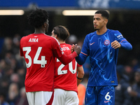 Ola Aina of Nottingham Forest shakes hands with Levi Colwill of Chelsea after the final whistle during the Premier League match between Chel...