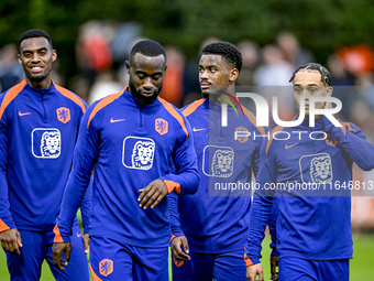 Netherlands players Lutsharel Geertruida, Xavi Simons, and Jorrel Hato participate in the training and press conference for the Netherlands...