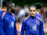 Netherlands players Lutsharel Geertruida and Xavi Simons participate in the training and press conference for the Netherlands Nations League...