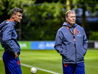 Netherlands assistant trainer Wim Jonk and Netherlands trainer coach Ronald Koeman are present during the training and press conference for...