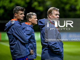 Netherlands assistant trainer Wim Jonk, Netherlands trainer coach Ronald Koeman, and Netherlands assistant trainer Erwin Koeman are present...