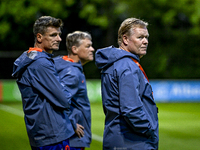 Netherlands assistant trainer Wim Jonk, Netherlands trainer coach Ronald Koeman, and Netherlands assistant trainer Erwin Koeman are present...