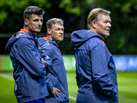 Netherlands assistant trainer Wim Jonk, Netherlands trainer coach Ronald Koeman, and Netherlands assistant trainer Erwin Koeman are present...