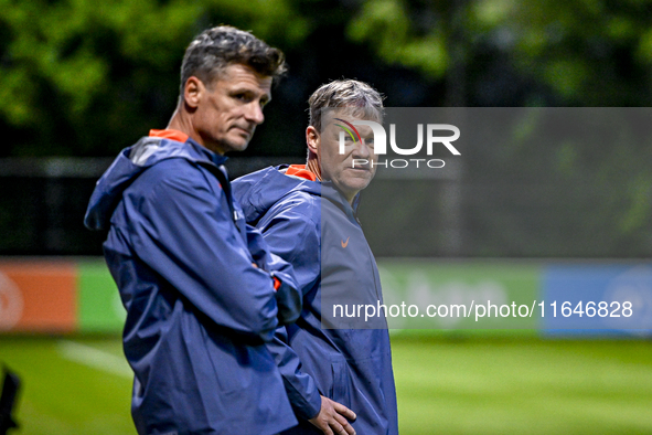 Netherlands assistant trainer Wim Jonk and Netherlands assistant trainer Erwin Koeman participate in the training and press conference for t...