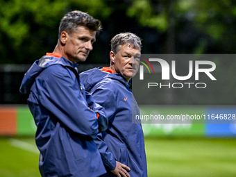 Netherlands assistant trainer Wim Jonk and Netherlands assistant trainer Erwin Koeman participate in the training and press conference for t...