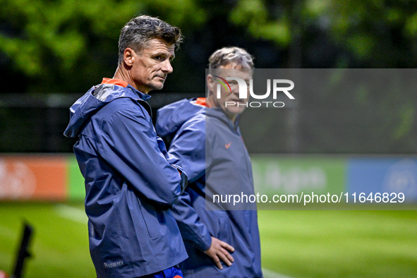 Netherlands assistant trainer Wim Jonk and Netherlands assistant trainer Erwin Koeman participate in the training and press conference for t...