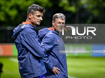 Netherlands assistant trainer Wim Jonk and Netherlands assistant trainer Erwin Koeman participate in the training and press conference for t...