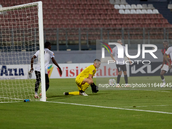 Hugo Sacco, the goalkeeper of Hibernians, is in action during the Malta 360 Sports Premier League soccer match between Hamrun Spartans and H...