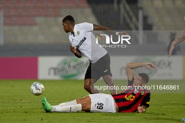 Rodrigo Khevin Fraga of Hibernians is challenged for the ball by Raphael Lopes Silva of Hamrun Spartans during the Malta 360 Sports Premier...