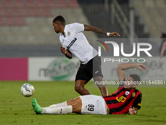 Rodrigo Khevin Fraga of Hibernians is challenged for the ball by Raphael Lopes Silva of Hamrun Spartans during the Malta 360 Sports Premier...