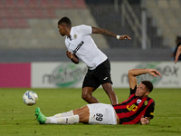 Rodrigo Khevin Fraga of Hibernians is challenged for the ball by Raphael Lopes Silva of Hamrun Spartans during the Malta 360 Sports Premier...