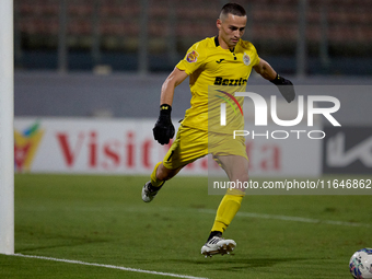 Hugo Sacco, goalkeeper of Hibernians, is in action during the Malta 360 Sports Premier League soccer match between Hamrun Spartans and Hiber...