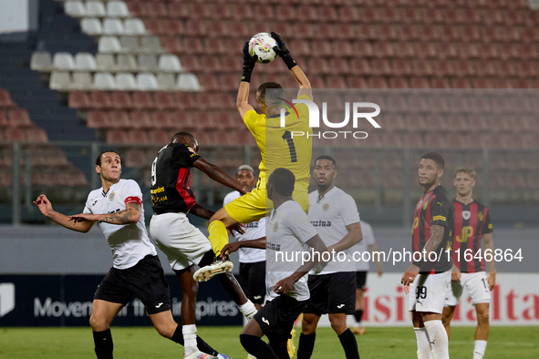 Hugo Sacco, the goalkeeper of Hibernians, is in action during the Malta 360 Sports Premier League soccer match between Hamrun Spartans and H...