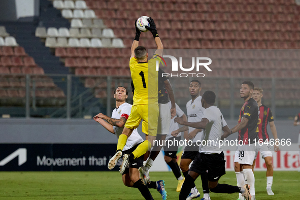 Hugo Sacco, the goalkeeper of Hibernians, is in action during the Malta 360 Sports Premier League soccer match between Hamrun Spartans and H...