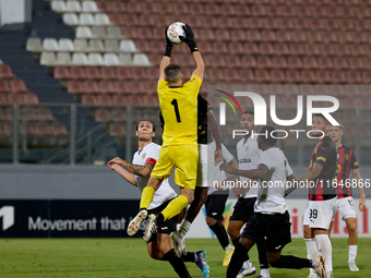 Hugo Sacco, the goalkeeper of Hibernians, is in action during the Malta 360 Sports Premier League soccer match between Hamrun Spartans and H...