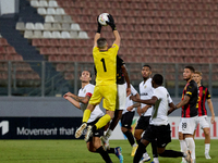 Hugo Sacco, the goalkeeper of Hibernians, is in action during the Malta 360 Sports Premier League soccer match between Hamrun Spartans and H...