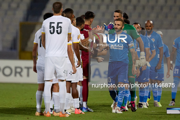 Soccer players from Zabbar St. Patrick and Marsaxlokk perform the ''high-five'' gesture with each other prior to the Malta 360 Sports Premie...