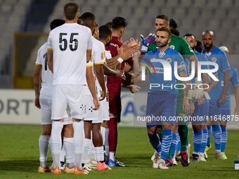 Soccer players from Zabbar St. Patrick and Marsaxlokk perform the ''high-five'' gesture with each other prior to the Malta 360 Sports Premie...