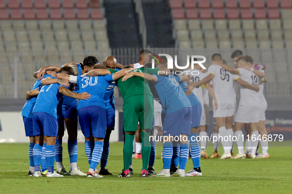 Soccer players from Zabbar St. Patrick and Marsaxlokk huddle prior to the Malta 360 Sports Premier League soccer match between Zabbar St. Pa...