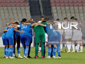 Soccer players from Zabbar St. Patrick and Marsaxlokk huddle prior to the Malta 360 Sports Premier League soccer match between Zabbar St. Pa...